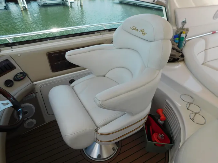  Yacht Photos Pics Luxurious helm seat on 2004 Sea Ray 600 Sun Sport yacht, docked at marina.