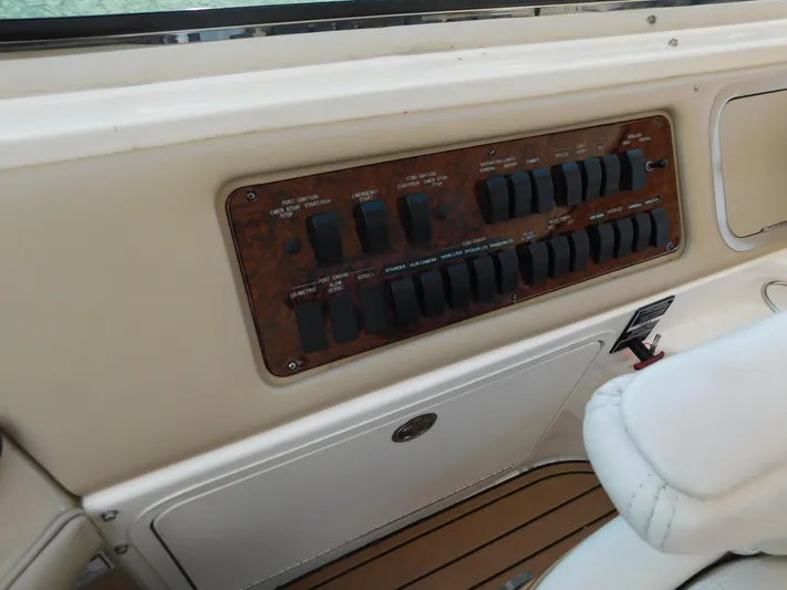  Yacht Photos Pics Control panel of a 2004 Sea Ray 600 Sun Sport boat with switches and labels.