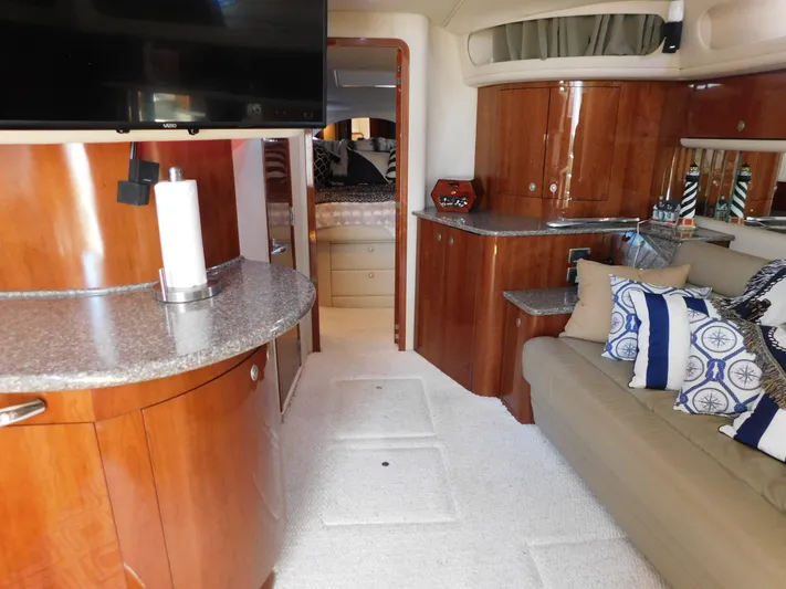  Yacht Photos Pics Luxurious interior of a 2004 Sea Ray 600 Sun Sport yacht with elegant wood finishes.