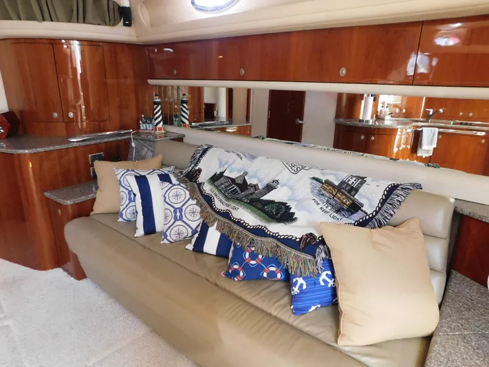  Yacht Photos Pics Luxurious interior of 2004 Sea Ray 600 Sun Sport yacht with elegant seating and nautical decor.