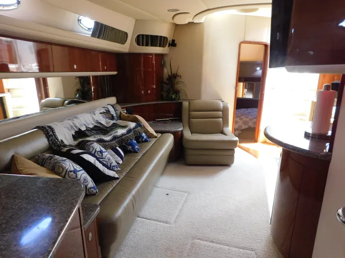  Yacht Photos Pics Luxurious interior of a 2004 Sea Ray 600 Sun Sport yacht with elegant seating and decor.