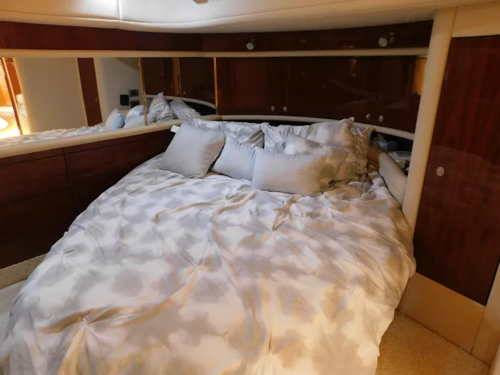  Yacht Photos Pics Luxurious bedroom interior of 2004 Sea Ray 600 Sun Sport yacht with plush bedding.
