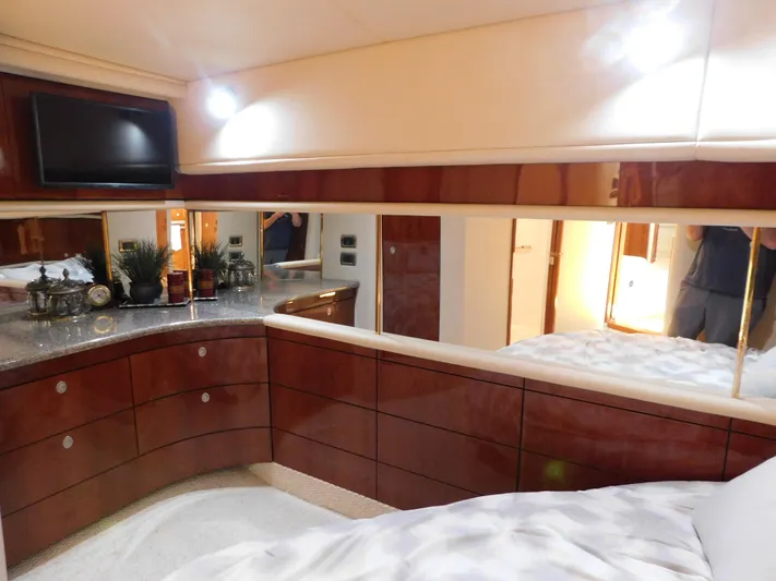  Yacht Photos Pics Luxurious cabin interior of 2004 Sea Ray 600 Sun Sport yacht with elegant wood finish.