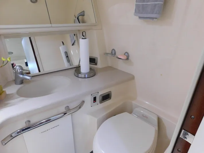  Yacht Photos Pics Bathroom interior of 2004 Sea Ray 600 Sun Sport yacht, featuring sink and toilet.