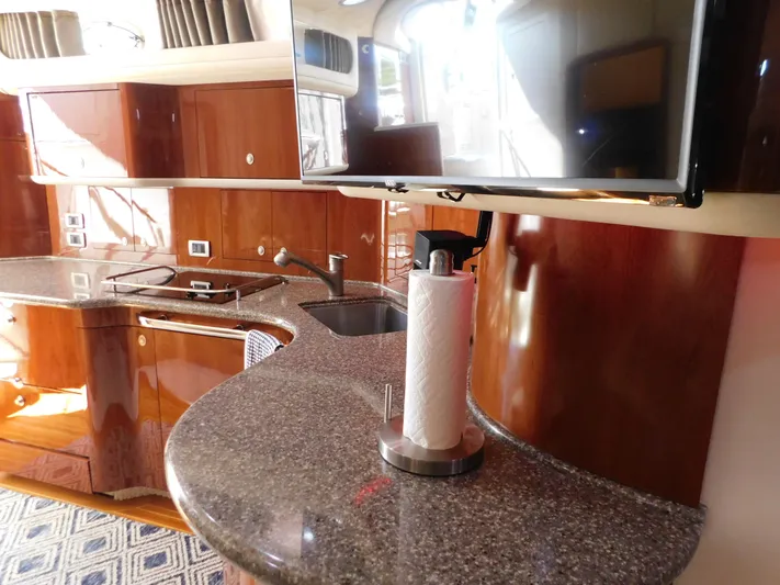  Yacht Photos Pics Luxurious 2004 Sea Ray 600 Sun Sport yacht kitchen with sleek countertops and modern amenities.