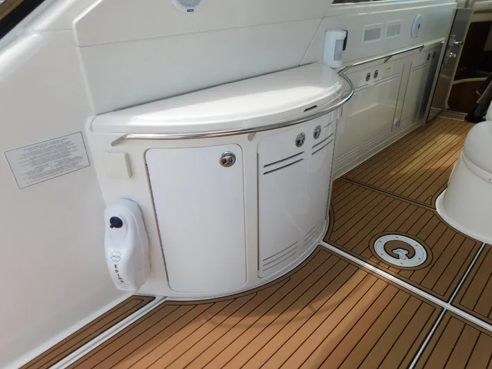  Yacht Photos Pics 2004 Sea Ray 600 Sun Sport yacht interior with sleek cabinetry and teak flooring.