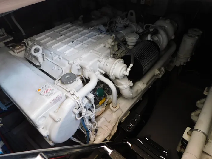  Yacht Photos Pics Engine compartment of a 2004 Sea Ray 600 Sun Sport boat, showcasing detailed machinery.