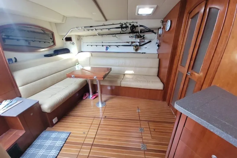 Hi Ho Silver Yacht Photos Pics Luxurious interior of 2011 Rampage 41 Express yacht with seating and fishing gear.