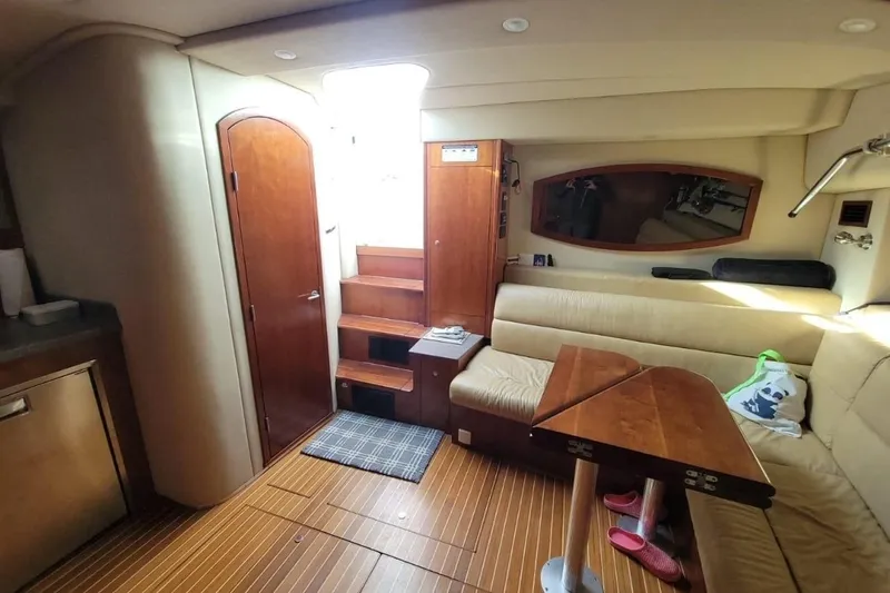 Hi Ho Silver Yacht Photos Pics Interior of 2011 Rampage 41 Express yacht with wooden flooring and beige seating.
