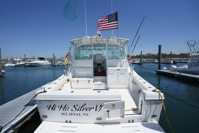 Hi Ho Silver Yacht Photos Pics 2011 Rampage 41 Express boat docked, displaying American flag, named "Hi Ho Silver VI".