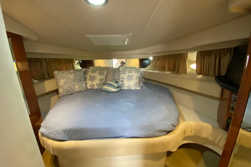 Wild Card Yacht Photos Pics Luxurious cabin interior of 2004 Sea Ray 380 Sundancer with cozy bedding.