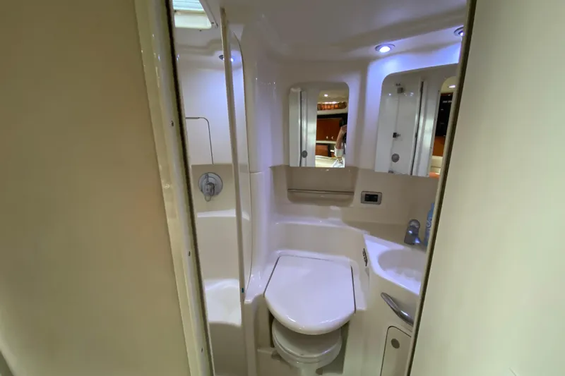 Wild Card Yacht Photos Pics Bathroom interior of 2004 Sea Ray 380 Sundancer yacht, featuring modern fixtures and lighting.