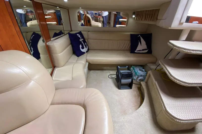 Wild Card Yacht Photos Pics Interior of 2004 Sea Ray 380 Sundancer yacht with beige seating and nautical decor.