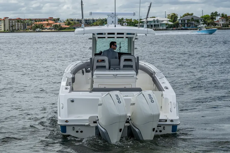  Yacht Photos Pics 2023 Boston Whaler 330 Outrage boat with dual engines on water.