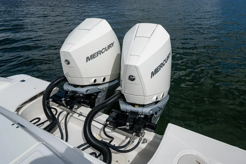  Yacht Photos Pics 2023 Boston Whaler 330 Outrage with dual Mercury outboard engines on water.