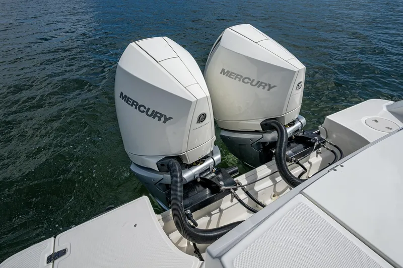  Yacht Photos Pics 2023 Boston Whaler 330 Outrage with dual Mercury outboard engines on water.