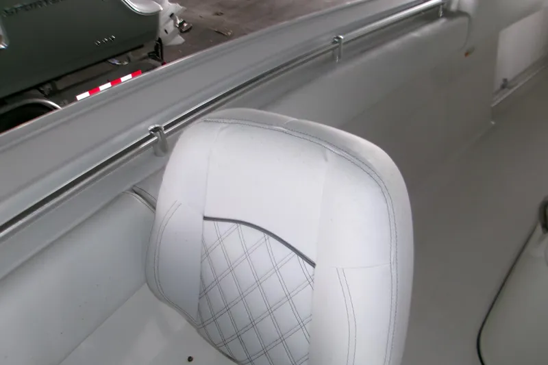  Yacht Photos Pics 2023 Sportsman Open 282 Center Console boat interior with white cushioned seating.