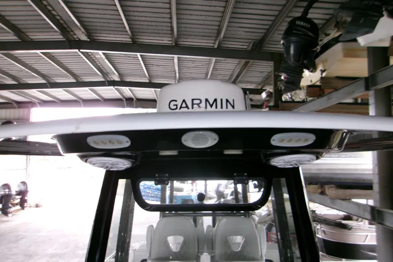  Yacht Photos Pics 2023 Sportsman Open 282 Center Console with Garmin equipment in a covered storage area.