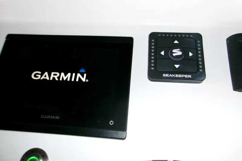  Yacht Photos Pics Garmin and Seakeeper controls on 2023 Sportsman Open 282 Center Console boat.