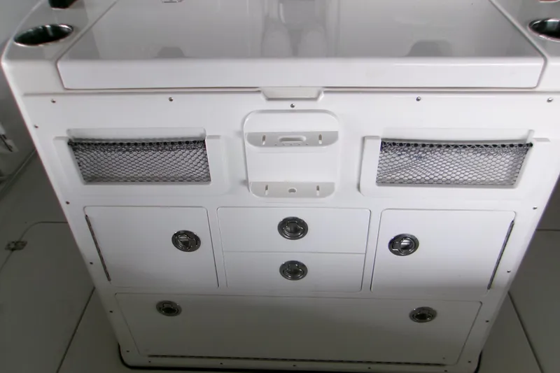  Yacht Photos Pics 2023 Sportsman Open 282 Center Console storage compartment with drawers and mesh pockets.