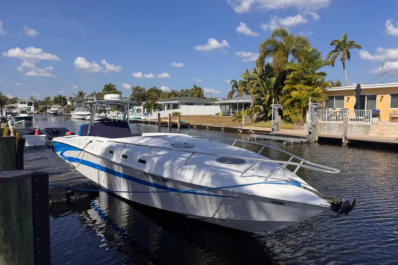  Yacht Photos Pics 2004 Don Smith 45 Custom boat docked in a sunny canal setting.