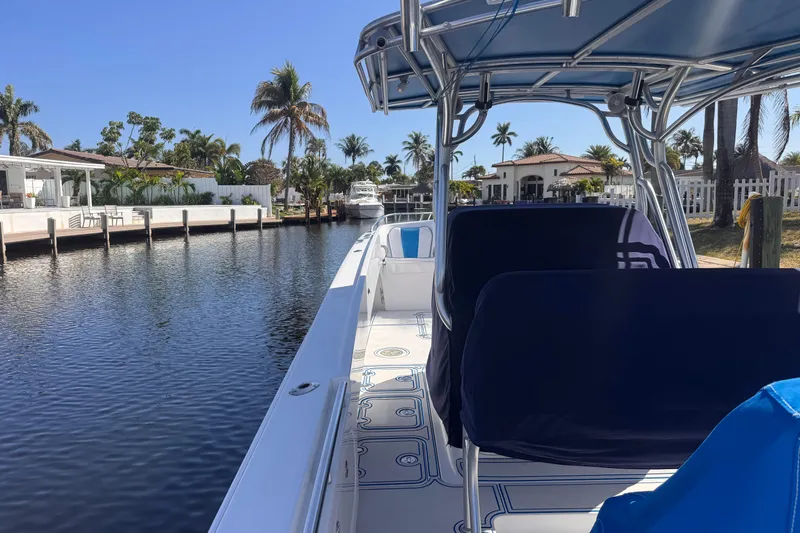  Yacht Photos Pics 2004 Don Smith 45 Custom boat docked by waterfront homes, palm trees, and clear blue sky.