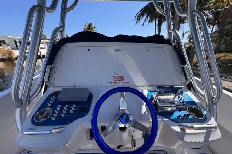  Yacht Photos Pics 2004 Don Smith 45 Custom boat dashboard with blue steering wheel and control panels.