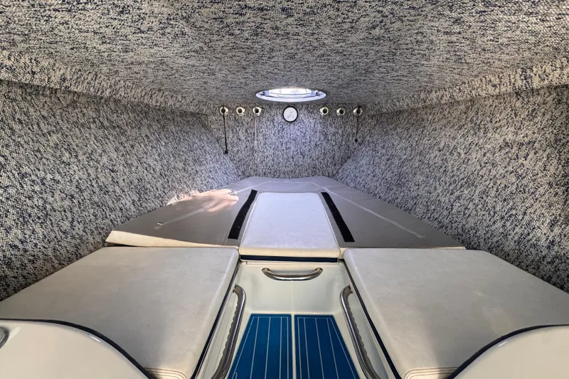  Yacht Photos Pics Interior cabin of a 2004 Don Smith 45 Custom boat, featuring cushioned seating and a hatch.