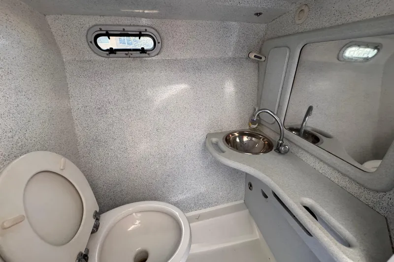  Yacht Photos Pics Compact bathroom in a 2004 Don Smith 45 Custom boat, featuring a toilet and sink.