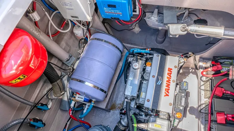 Dreamboat Annie Yacht Photos Pics Engine compartment of a 2022 Bali 4.8 yacht with Yanmar engine and electrical components.