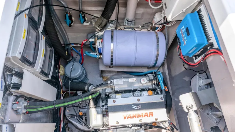 Dreamboat Annie Yacht Photos Pics Engine room of a 2022 Bali 4.8 yacht featuring Yanmar engine and electrical components.