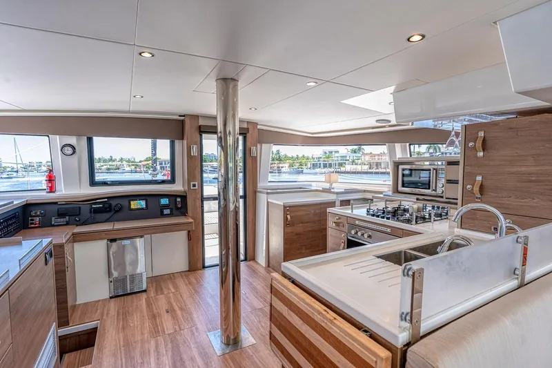 Dreamboat Annie Yacht Photos Pics Luxurious interior of 2022 Bali 4.8 yacht with modern kitchen and panoramic windows.