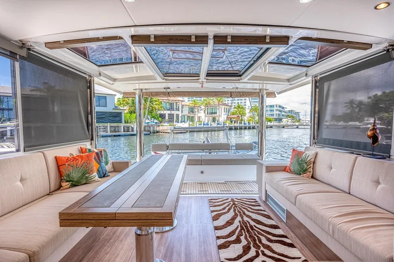 Dreamboat Annie Yacht Photos Pics Luxurious interior of 2022 Bali 4.8 yacht with waterfront view and stylish seating.