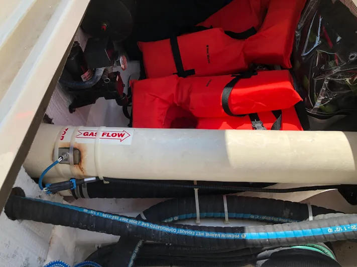  Yacht Photos Pics Storage compartment in a 2009 Sabre 40 Sedan with life jackets and gas flow pipe.