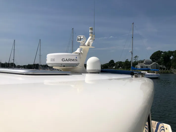  Yacht Photos Pics 2009 Sabre 40 Sedan yacht with Garmin radar, docked in a serene marina.