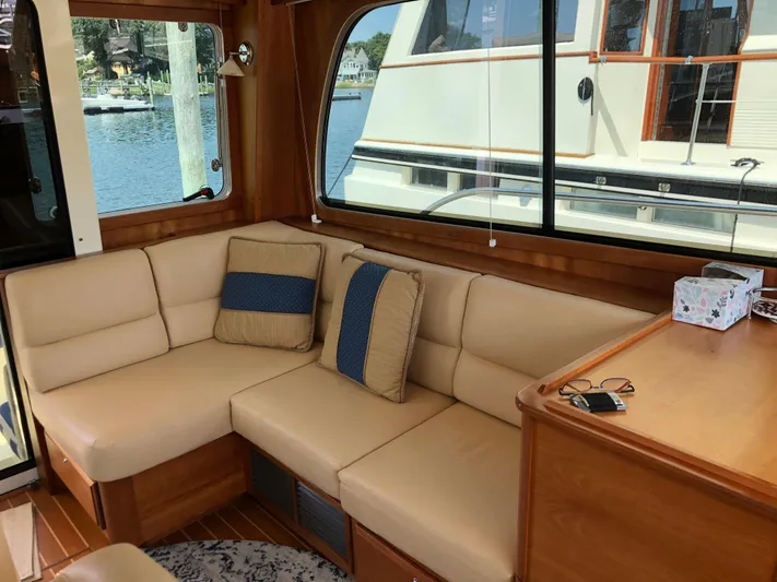  Yacht Photos Pics Interior of 2009 Sabre 40 Sedan with beige seating and large windows.