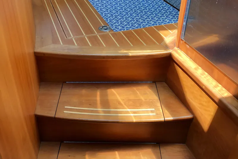  Yacht Photos Pics Wooden steps inside a 2009 Sabre 40 Sedan yacht, featuring elegant design and craftsmanship.