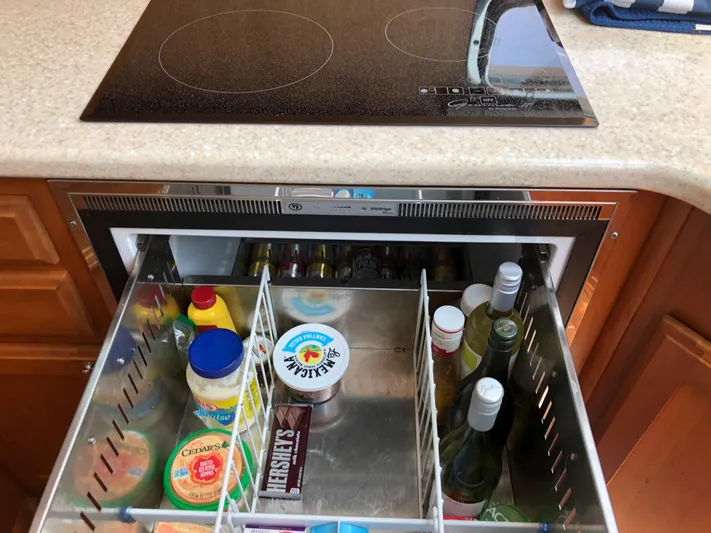  Yacht Photos Pics Drawer fridge with beverages and condiments in a 2009 Sabre 40 Sedan kitchen.