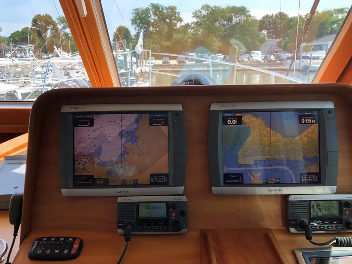  Yacht Photos Pics Navigation system on a 2009 Sabre 40 Sedan yacht, featuring dual displays and communication devices.