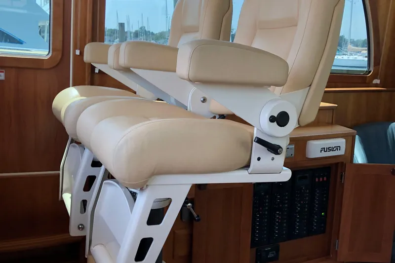  Yacht Photos Pics 2009 Sabre 40 Sedan interior with beige leather seats and wooden paneling.