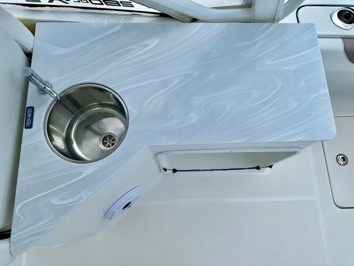  Yacht Photos Pics 2021 World Cat 280 DC-X boat sink with sleek countertop design.