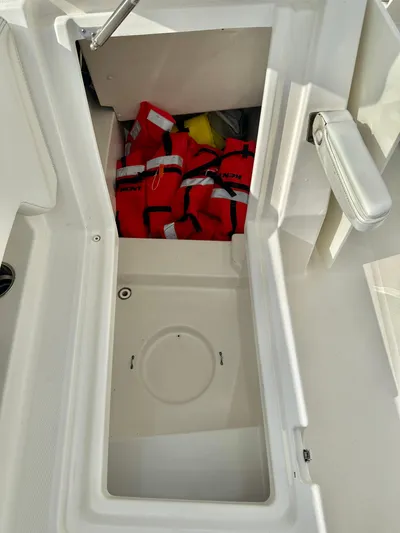  Yacht Photos Pics Storage compartment on a 2021 World Cat 280 DC-X boat with life jackets inside.