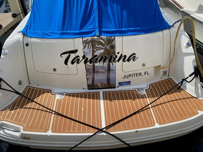Taramina Yacht Photos Pics 2008 Sea Ray 38 Sundancer boat with blue cover, named "Taormina," docked in Jupiter, FL.