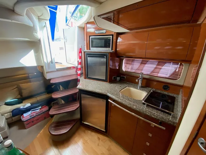 Taramina Yacht Photos Pics Interior of 2008 Sea Ray 38 Sundancer yacht with modern kitchen amenities.