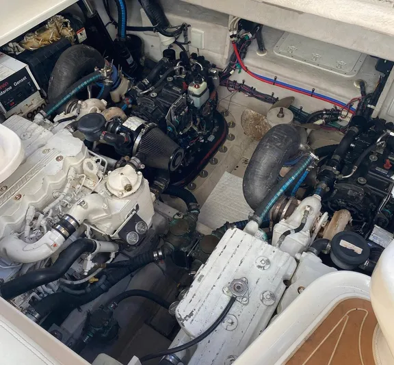 Taramina Yacht Photos Pics Engine compartment of a 2008 Sea Ray 38 Sundancer boat, showcasing dual engines.