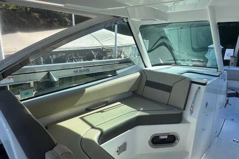 In Pursuit Yacht Photos Pics 2019 Pursuit DC 325 Dual Console interior with cushioned seating and sleek design.