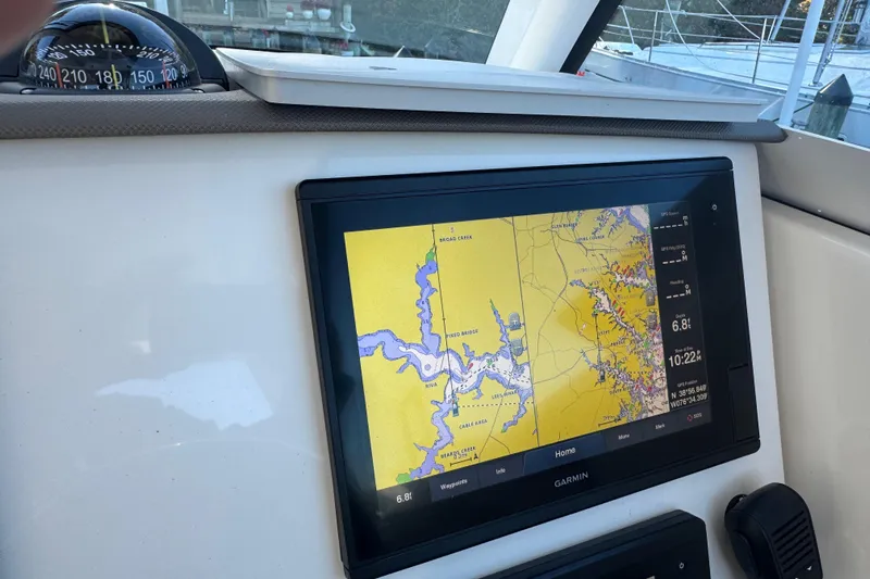 In Pursuit Yacht Photos Pics 2019 Pursuit DC 325 Dual Console with Garmin navigation display and compass.