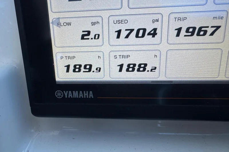 In Pursuit Yacht Photos Pics Yamaha display showing fuel flow, usage, and trip data on Pursuit DC 325 boat.
