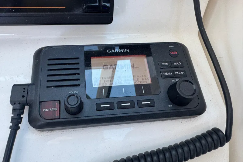 In Pursuit Yacht Photos Pics Garmin marine radio on 2019 Pursuit DC 325 Dual Console boat dashboard.