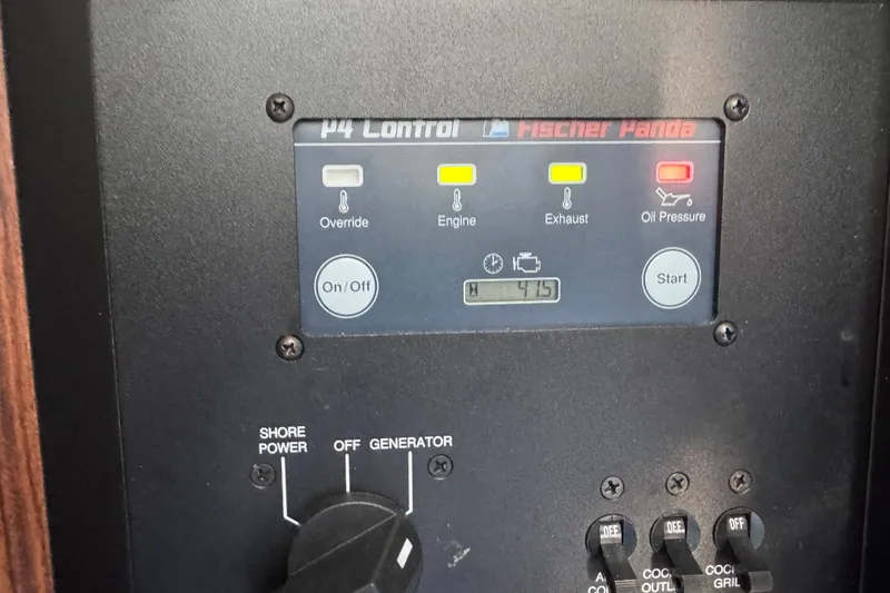 In Pursuit Yacht Photos Pics Control panel of a 2019 Pursuit DC 325 Dual Console boat, featuring Fischer Panda system.